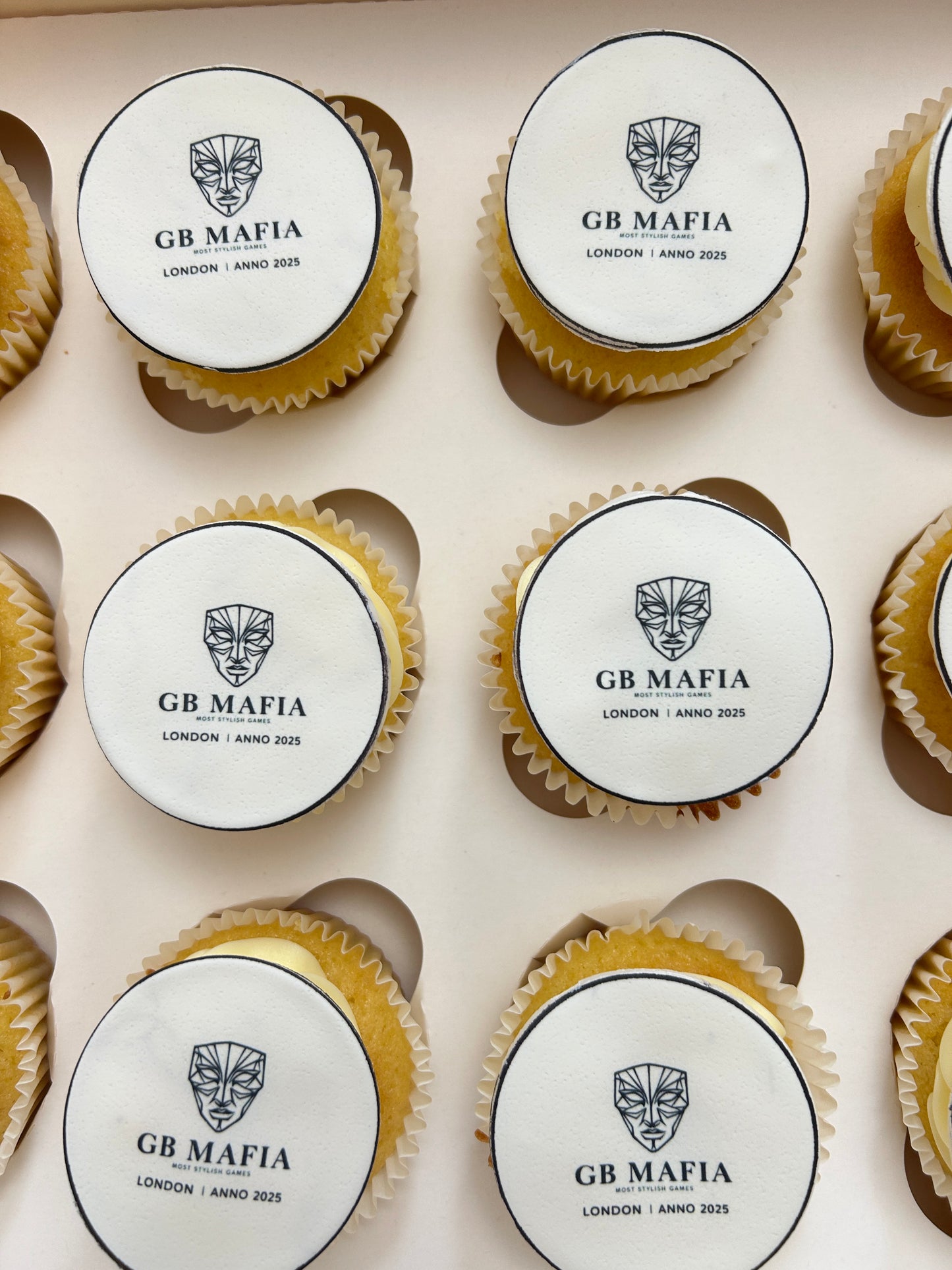 Cupcakes with customised branding arranged in a box. Delivery in London and Sevenoaks