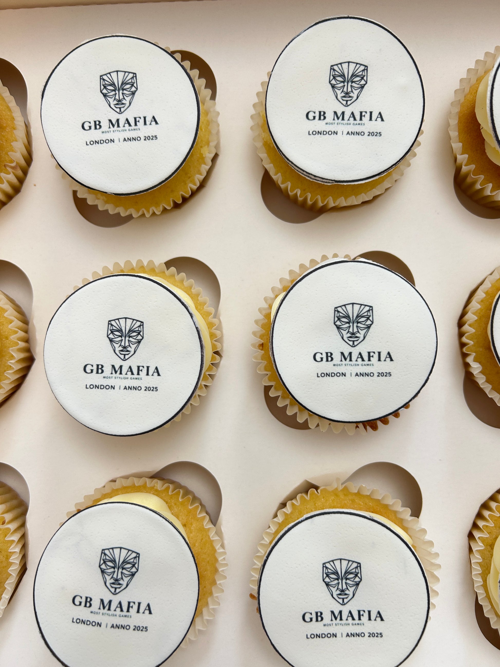 Cupcakes with customised branding arranged in a box. Delivery in London and Sevenoaks