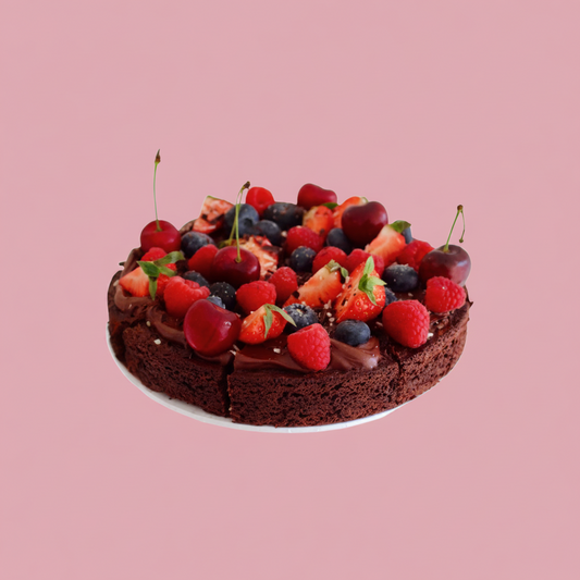 Chocolate brownie with berries on a pink background, featuring a gluten-free logo.
